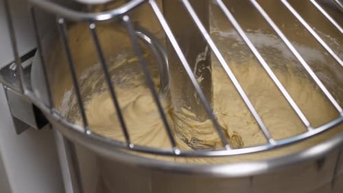Dough Being Mixed in Industrial Stainless Steel Mixer