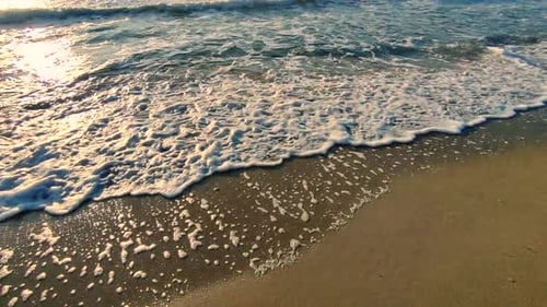 Sea Waves Rolling on Sandy Shore Beach on Sea Coast Dawn Sunset Blue Sea Waves