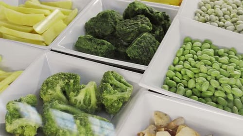 Different Frozen Vegetables As Background in Store Supermarket Top View