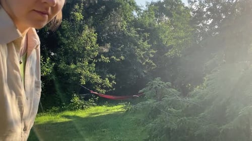 Woman Puts Egg on Table Outside