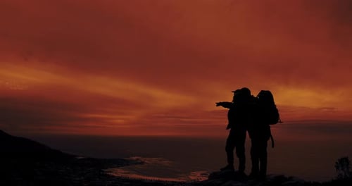 Sunset, people and silhouette at horizon on mountain for view, peace and travel in nature