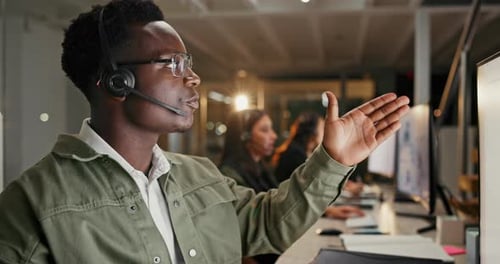 Black man, call center and consulting with computer at night for customer service