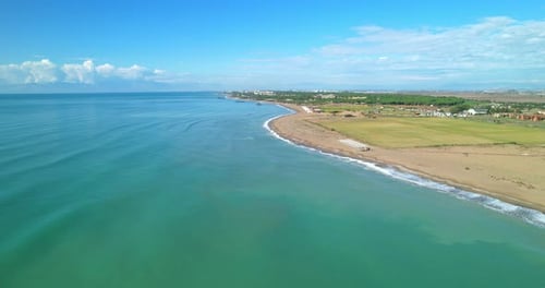 Aerial View of Deserted Seascape with the Movement of Waves Along the Shore