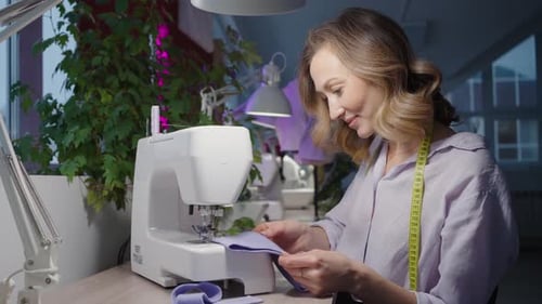 Woman Works at Sewing Machine Workshop of Professional Designer Hobbies Needlework
