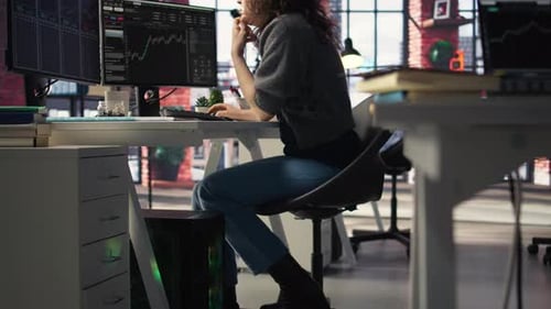 Woman working at desk in modern office