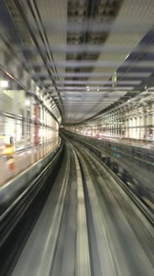 Tokyo Monorail Passing Through the City's Skyscapers in Vertical