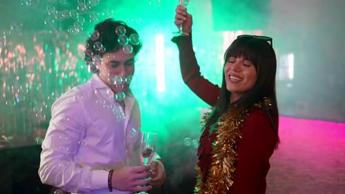 Friends at a Party Toasting with Champagne in Club