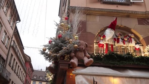 christmas trees and decorations on top of a european store front at Festive Christmas market in Stra