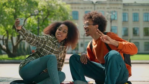 Students Take Cheerful Selfie on Campus Grounds