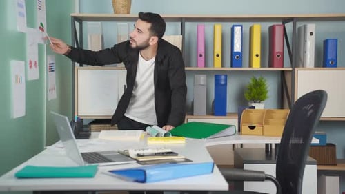 Young Adult Working in Modern Office Setting