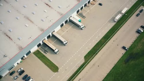 High Angle Drone View of Semi Trucks at Distribution Center