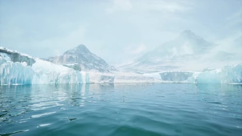 Vast Ocean View With Distant Snow Covered Mountain Range Rising