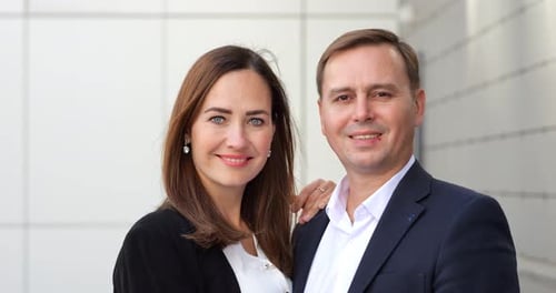Happy Married Couple Embraces Showing Key to New Apartment