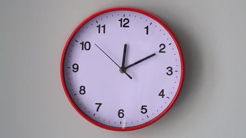 Clock Hands Moving Rapidly on Wall