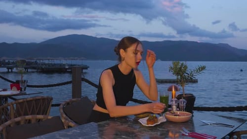 Woman Dining Seaside