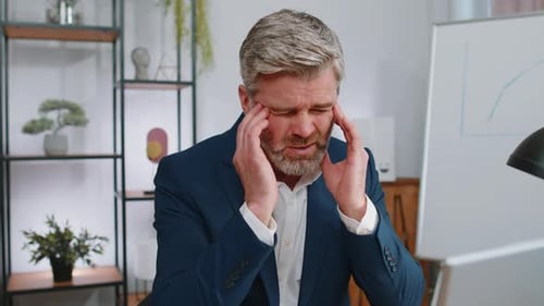 Tired Mature Business Man Suffering From Headache Problem Tension Migraine Stress at Home Office