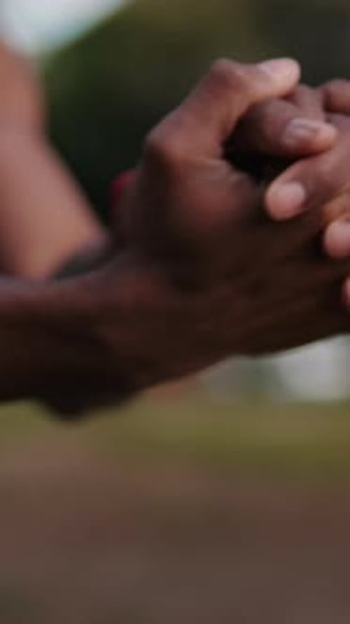 Vertical video, Athlete Stretching Hands in the Park