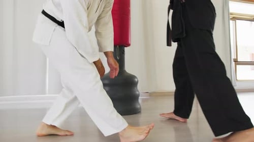Men Train Kicks For Karate Sports In The Gym