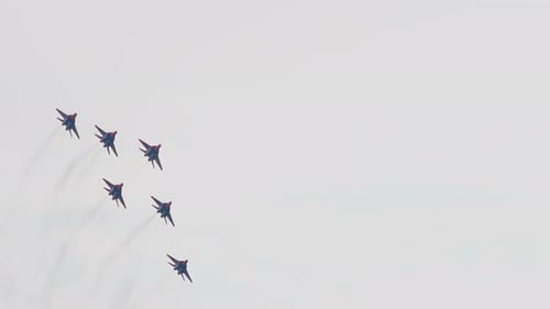 Jet Planes Flying in Formation Leaving Smoke Trails