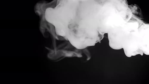 Abstract Slow Motion Footage of White Smoke in Slow Motion Fog in Light Spot Background