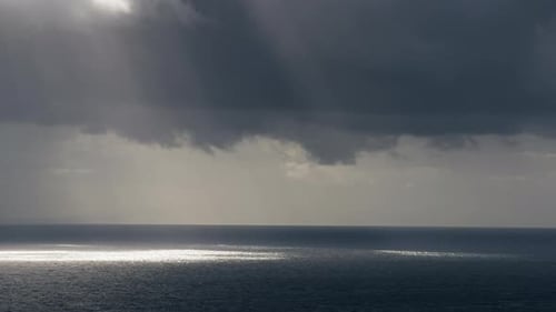 Beams of Lights Hit the Ocean Surface