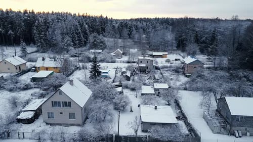 Charming Winter Village Resting Comfortably in a Beautiful Snowy Landscape Soft Focus Aerial View