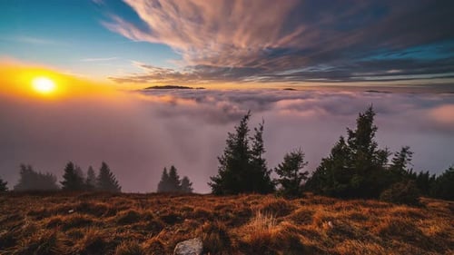 Sunrise over Mountain Range with Sea of Clouds