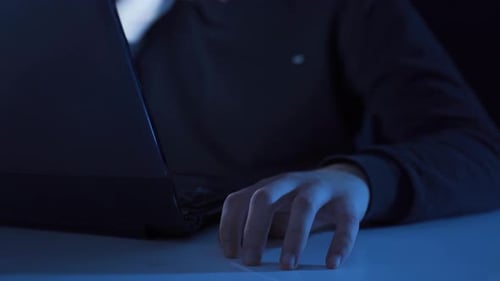 Typing on a Laptop in a Dark Environment