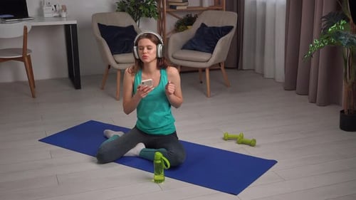 Woman Listening to Music and Dancing Indoors