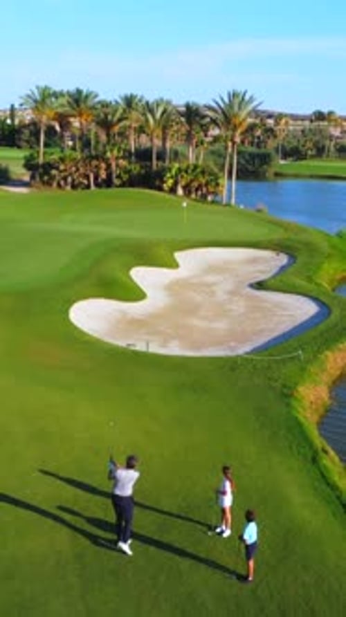 Golfers Enjoying Game on Tropical Golf Course