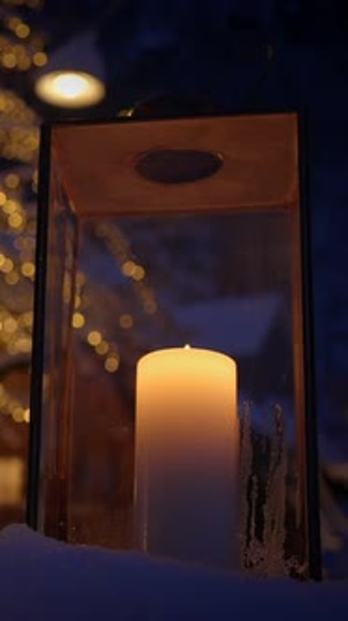 The Warm Candle Glow Illuminates a Lantern During a Beautiful Winter Night Setting