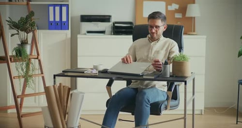 Businessman Resting After Work in Office