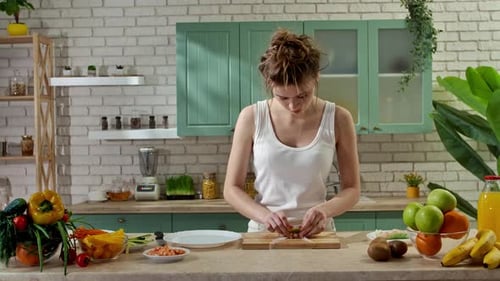 Young Woman at the Table in the Kitchen Preparing Spring Rolls for Healthy Lunch Rolls Thin Wrapper