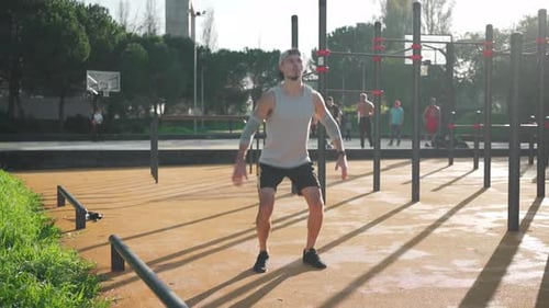 Man Doing Squat Workout in Outdoor Fitness Area