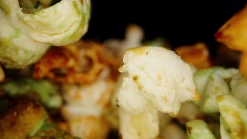 Inside colorful sweet popcorn. Macro dolly.