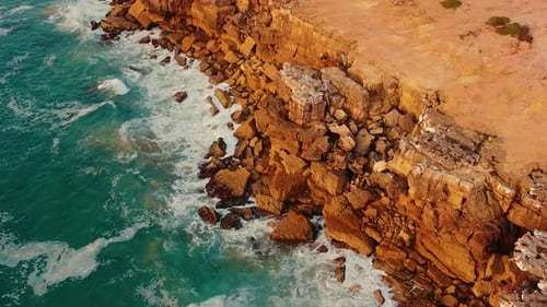 Waves Hitting Rocks Softly On Foz Do Lizandro Beach in Ericeira Portugal