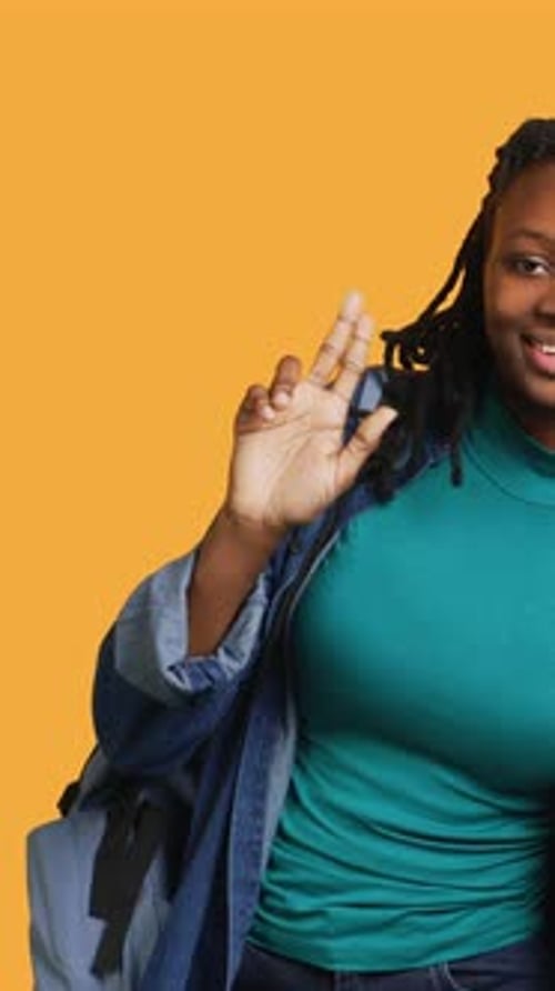 Vertical Video Cheerful Girl with Hand Up Volunteering to Tell Teacher Explanation to Question