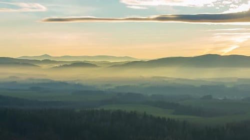 Golden Hour Light Over Rolling Hills and Forest