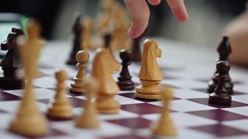 Close-up of a Chess Player Moving a Chess Piece on the Chess Board. Chess Tournament, Competition
