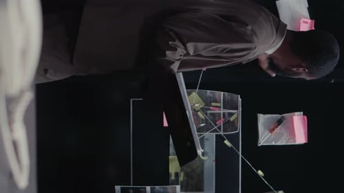 Detective Examines Clues on Case Board