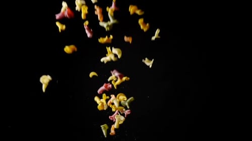 Colorful Pasta Shapes Falling in Slow Motion