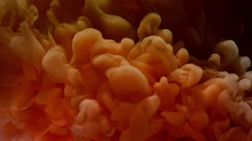 Swirling abstract tan and brown ink cloud