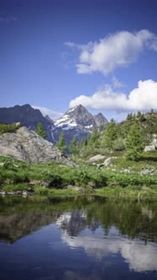 Alpine Lake With Mountain Reflection