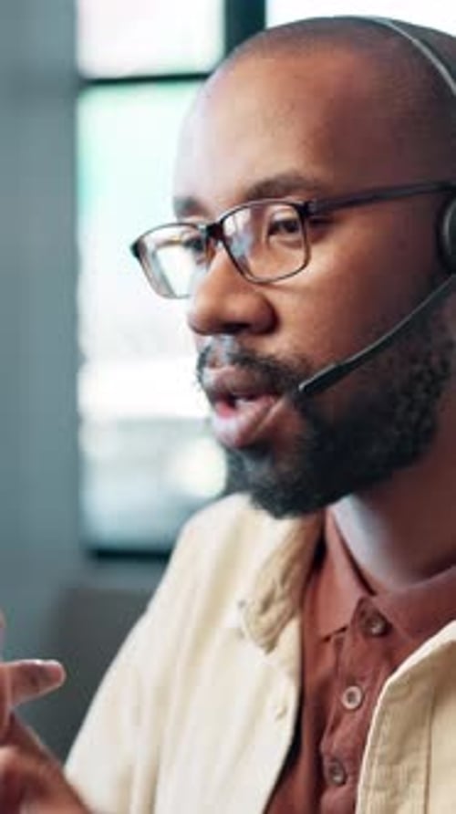 African man, call center and headset with discussion, advice and consulting with mic at office