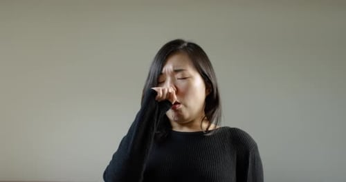 Asian Woman Coughing With Corona Virus