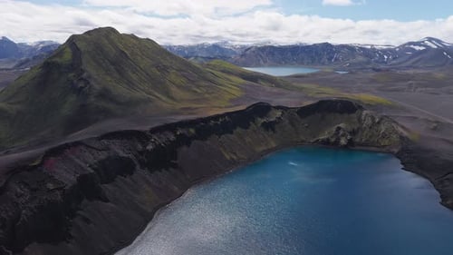 Aerial View of Icelandic Valley with Moss Volcanic Terrain and Lake