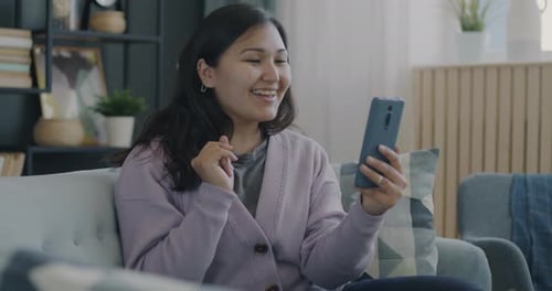 Woman Enjoying a Video Call at Home