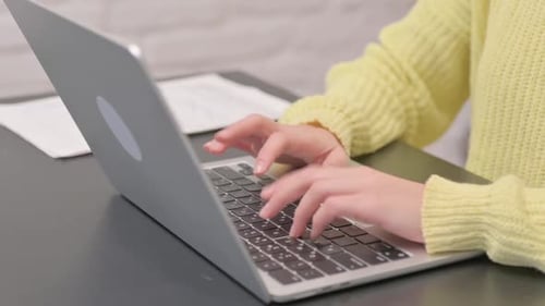 Close Up of Woman Typing on Laptop