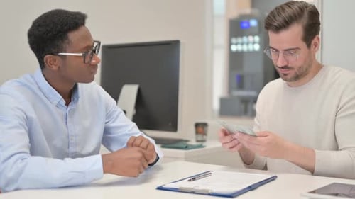 African Man Gives Money and Shaking Hand in Office