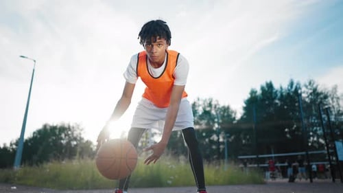Young Black Basketball Player Training on Outdoor Court Junior Streetballer Sportsman Practicing on